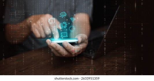 Digital technology and cloud computing: concept. A man using his smartphone and laptop to create, store, process, and communicate information and data n binary code