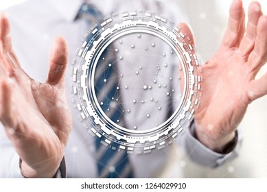 Digital technology concept between hands of a man in background