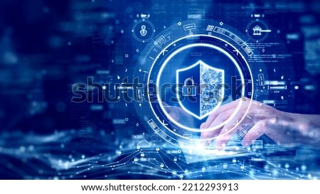 digital technology concept cyber security data protection internet network connection. Man accessing a computer device with a protective shield against cyber threats. polygon on dark blue background.