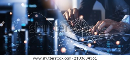 Digital technology, data exchange, cloud computing, global business concept. Businessman working on laptop and digital tablet with internet network, futuristic technology background