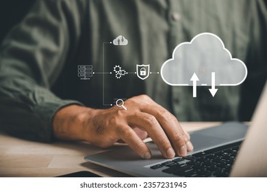 In a digital technology landscape, a computer engineer focuses on a laptop computer while surrounded by data center and big data storage. Discover the power of internet cloud network technology.