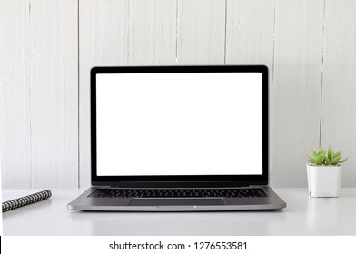 Digital technology Laptop muck up blank white screen and flower pot book on white table ,Home interior or office background - Shutterstock ID 1276553581