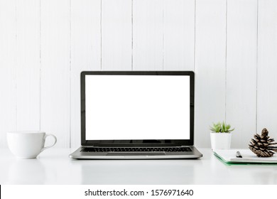 Digital technology Laptop muck up blank white screen and flower pot book on white table ,Home interior or office background - Shutterstock ID 1576971640