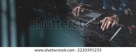 Digital technology, software development concept. Coding programmer, software engineer working on laptop with circuit board and javascript on virtual screen, internet of things IoT