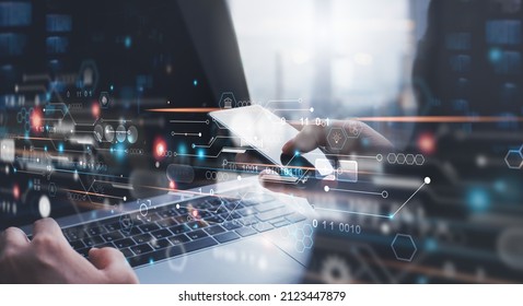 Digital technology, software development, Data exchange, Internet of Things concept. Man using mobile phone and laptop with circuit board on virtual screen, high speed internet technology