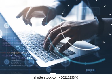 Digital technology, software development, IoT Internet of Things concept. Computer programmer, software developer coding on laptop computer with javascript, hologram, circuit board on virtual screen