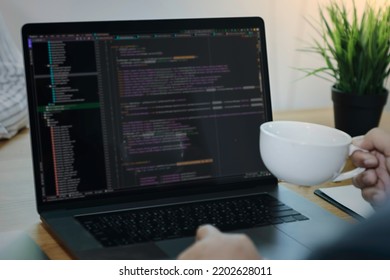 Digital technology, software development, IoT concept. Woman programmer, software developer working on laptop computer and smart city with big data, programming code.
