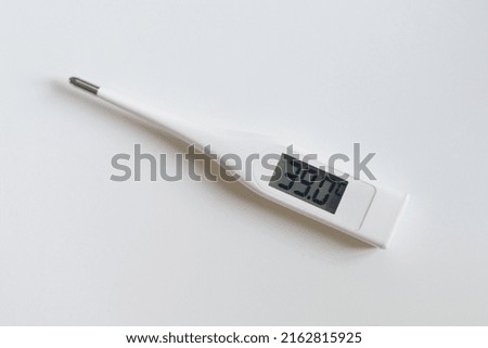 digital thermometer on white background showing blood heat 39 celsius degrees, high temperature, hard desease