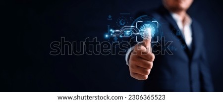 Digital thumb fingerprint scanner provides cyber security access with biometrics identification by business person touching screen with finger in background. Technology and two-faction authentication