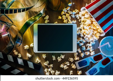 Digital Touch Screen Tablet With Popcorn, 3D Glasses And Filmstrip; Movie Online Streaming Cinema And Entertainment Concept