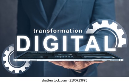 digital transformation. businessman holds in his hand tablet with text digital transformation and gears. Digital modernization and business processes to modern computer technologies - Shutterstock ID 2190923993