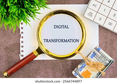 Digital transformation and digitalization technology. DIGITAL TRANSFORMATION through a magnifying glass on a white sheet of notepad.