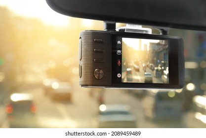 Digital video recorder car camera for safety on the road accident, Technology recorder device capturing video of front of vehicle automobile crash safety proof evidence.