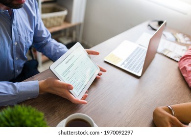 Digital visa application on a tablet. Travel agent asking customers to fill an online permit to go abroad on a vacation holiday - Powered by Shutterstock