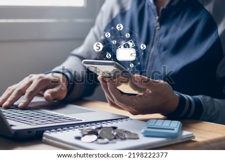 digital wallet icon and dollar icon, online wallet business concept. Man holding smartphone and using computer laptop with online transaction application, Concept of e-commerce and internet investment
