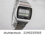 digital watch silver vintage retro wristwatch 70s 80s isolated alarm multifunctional chronograph scratched steel used made in japan rare worn
on watch stand Armbanduhr chronograph side view closeup