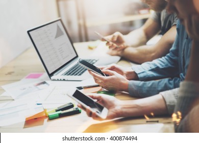 Digital World. Photo Young Business Managers Crew Working With New Startup Project.Notebook On Wood Table. Using Modern Smartphones, Typing Message, Analyze Plans Screen. Horizontal, Film Effect.