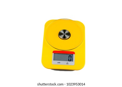 digital yellow kitchen measuring scale with red line, and 0 on the scale