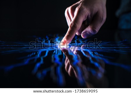 Digitalization Concept: Human Finger Pushes Touch Screen Button and Activates Futuristic Artificial Intelligence. Visualization of Machine Learning, AI, Computer Technology Merge with Humanity