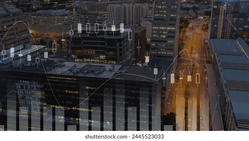 Digitally generated image of graphs moving in the screen with background of buildings in a city during the evening 4k