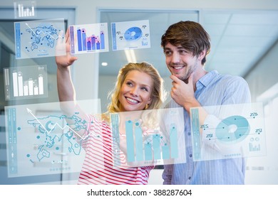 Digitally generated image of pie chart and bar graph against pretty businesswoman doing frame with her hands and showing to her partner