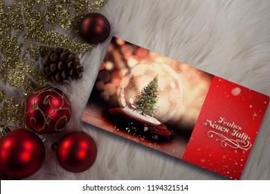 Digitally generated image of snow falling against Christmas tree against copy space with christmas decorations - Powered by Shutterstock