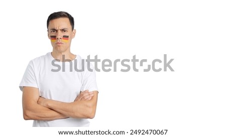 Dignified and serious man with german flag painted on face