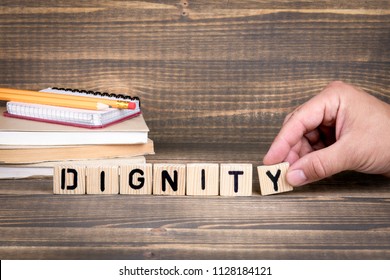 Dignity business concept. Wooden letters on the office desk, informative and communication background - Shutterstock ID 1128184121