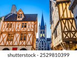 Dijon cityscape with old medieval houses fachwerk facades and Eglise Notre-Dame of Dijon Roman Catholic church in old town city historical centre, Bourgogne-Franche-Comte region, France