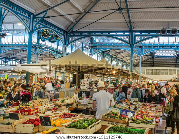 Dijon / France - September 21 2019: Les Halles,\
the covered market in Dijon, France. Food market. Fresh vegetables,\
cheese, meat and other specialities from the region. The Bourgogne\
wine district.