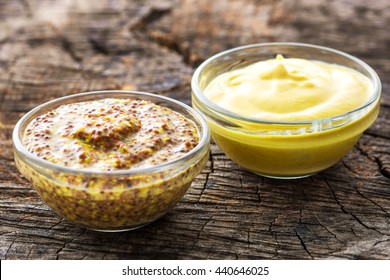 Dijon Mustard And Mustard On Wooden Background