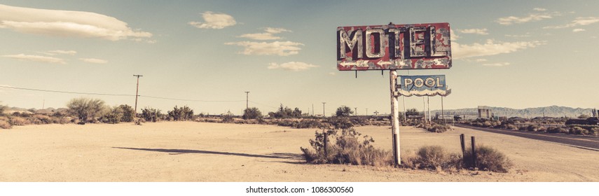 A dilapidated, classic, vintage motel sign in the desert of Arizona - Powered by Shutterstock