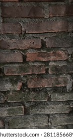 dilapidated and moss-covered brick wall construction