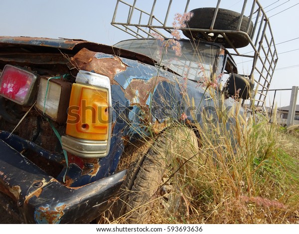 The dilapidated pickup truck\
is dumped alone not be able to operate and wait for someone repair\
it. 