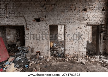 Dilapidated room inside abandoned structure featuring rubble, scattered trash, damaged brickwork, and empty doorways revealing nature outside in realistic decayed state