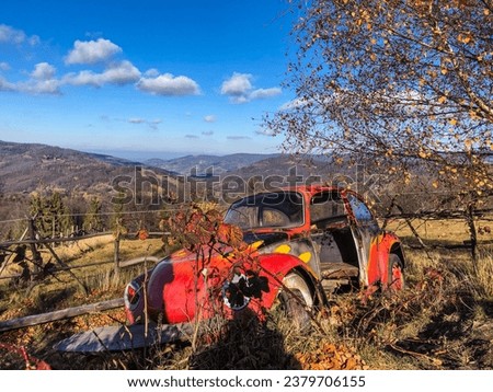 Dilapidated VW Beetle Against Mountain BackdropDilapidated VW Beetle Against Mountain Backdrop.