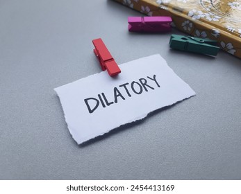 Dilatory writting on table background.
