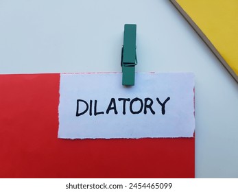 Dilatory writting on table background.