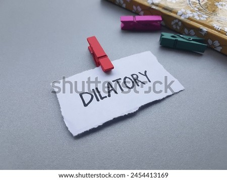 Dilatory writting on table background.