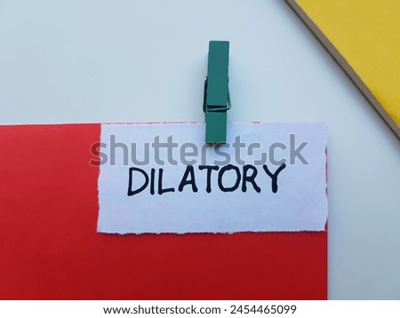 Dilatory writting on table background.