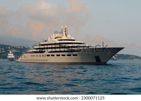 Dilbar yacht near shore by Monaco