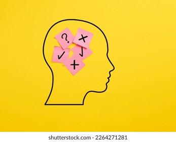 The dilemma between right and wrong. Decision making process. Sticky note papers in a human head with check mark and x mark symbols.
