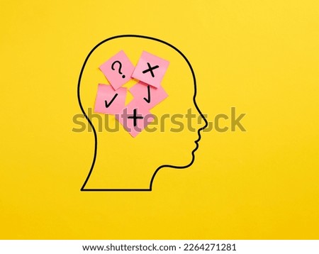The dilemma between right and wrong. Decision making process. Sticky note papers in a human head with check mark and x mark symbols.