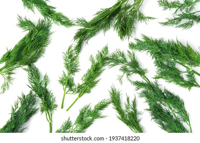 Dill branches are randomly arranged on a white table. Top view, horizontal.