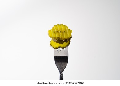 Dill Pickle Chips In Crinkle Cut Isolated On White Background