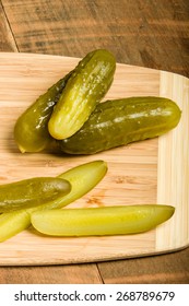 Dill Pickle Spears On Cutting Board