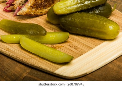 Dill Pickle Spears On Wooden Cutting Cutting Board