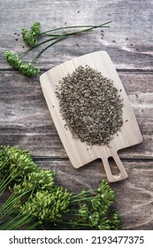 Dill Seeds And Flowers, Anethum Graveolens On Wooden Background, Overhead Flat Lay, Vertical Frame