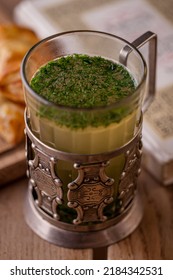 Dill Soup In A Mug On A Wooden Background