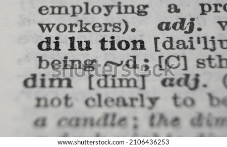 Dilution dictionary definition close-up. Shallow depth of field.